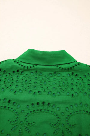 Green cotton eyelet collared dress with intricate cutwork detail.