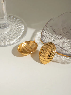 Gold dome earrings with sculpted ridges, 18K gold-plated.