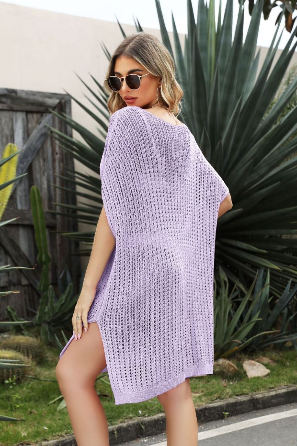 Lavender open-knit beach cover-up with side slit and short sleeves.