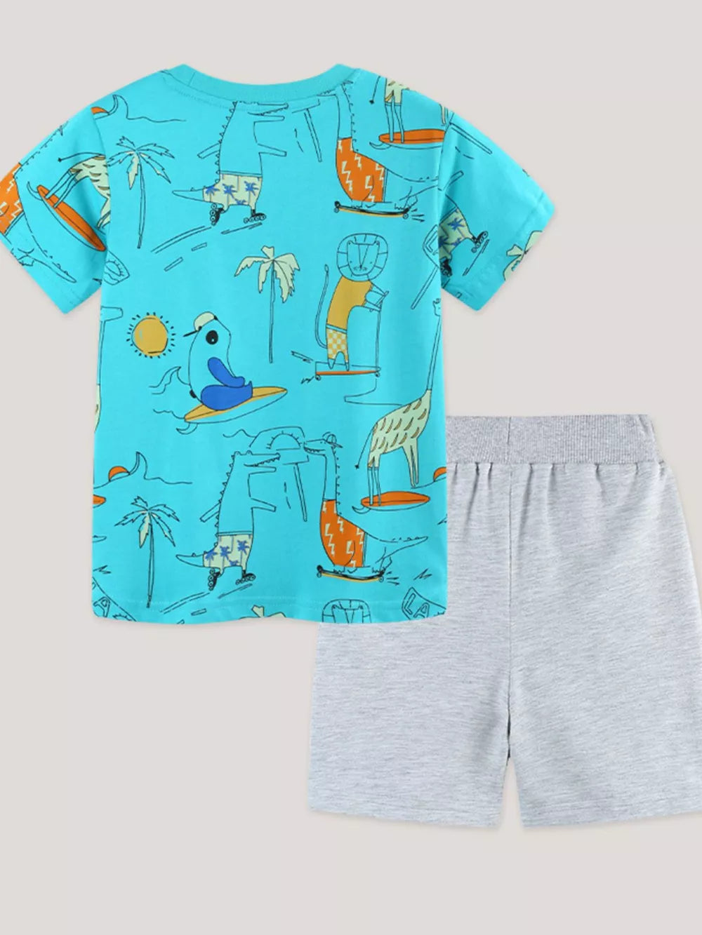 Boys' blue cotton t-shirt with animal surfing and skateboarding print, paired with grey shorts.