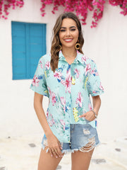 Tropical print camp collar shirt in sky blue with short sleeves and button front.