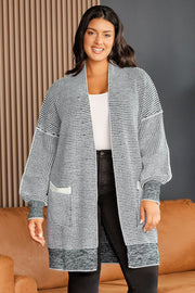 Textured knit cocoon cardigan in Cloudy Blue with pockets and balloon sleeves.