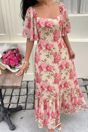 Charming floral midi dress with square neck, flutter sleeves, and ruffled hem.