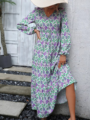 Vibrant paisley print V-neck dress with balloon sleeves and drawstring waist.