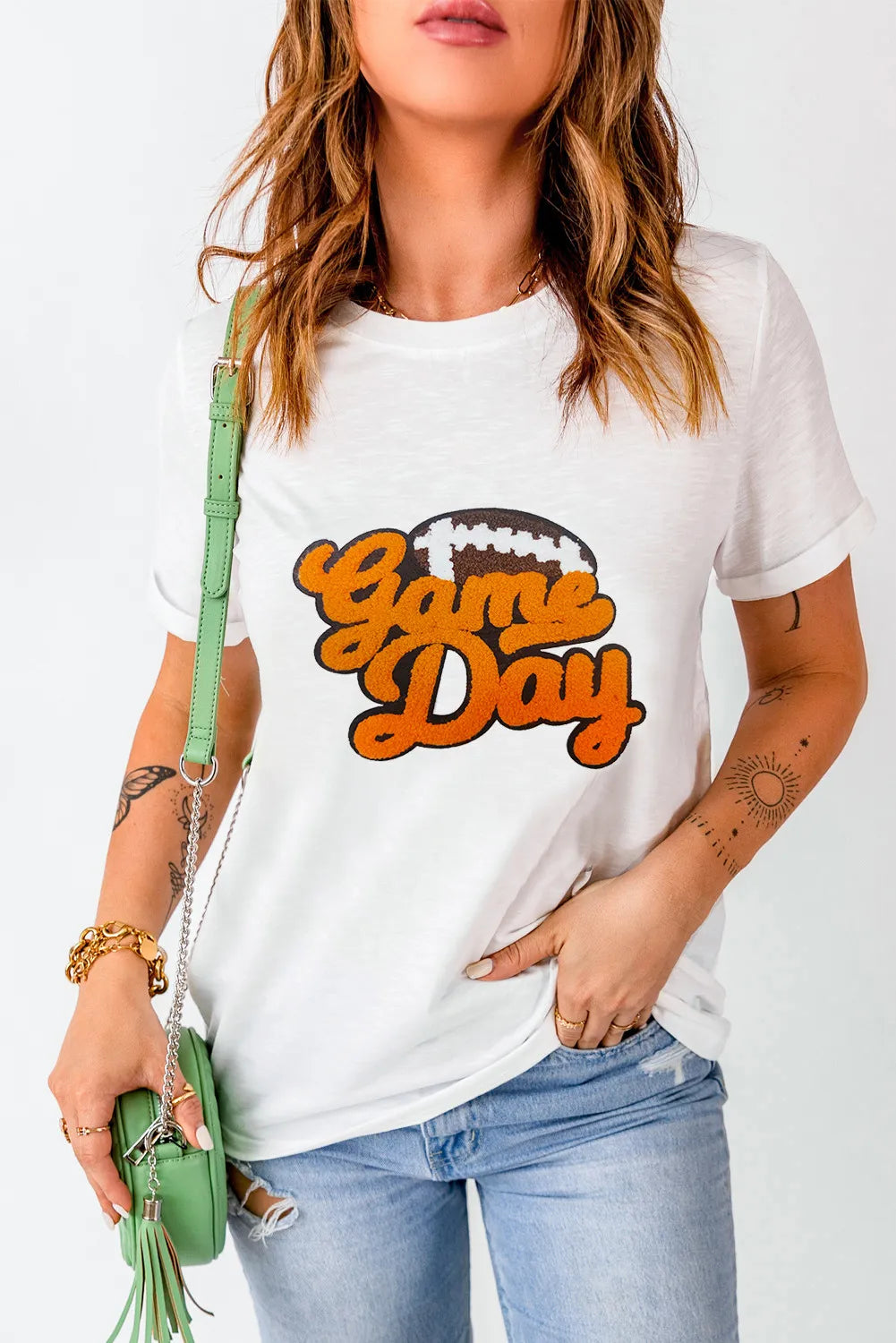 White graphic t-shirt with "Game Day" and football design