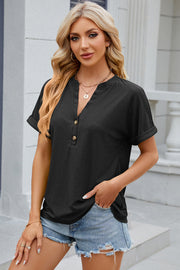 Black textured henley tee with rolled sleeves and button detail