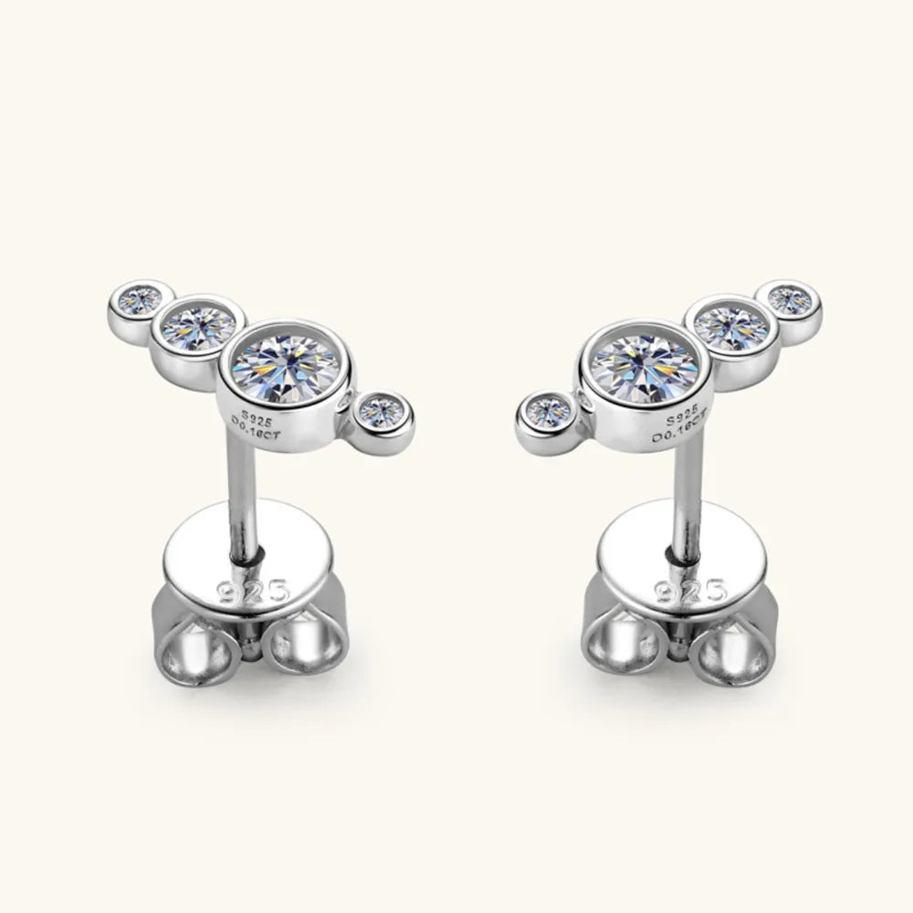 Silver ear climbers with five clear cubic zirconia stones in a celestial cluster design.