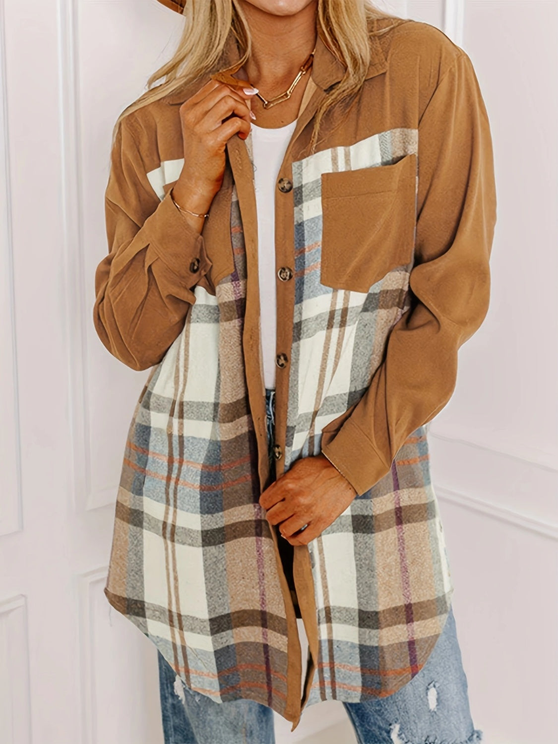 Caramel shacket with plaid panels and contrast sleeves, featuring a chest pocket and button front.