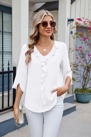 White V-neck flutter sleeve blouse with ruffled front detail and split sleeves.