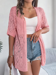 Open-knit diamond pattern cardigan in blush pink with short sleeves and an open front.