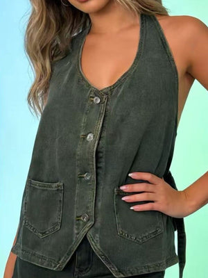 Button-down denim halter vest in gray with two front pockets and a V-neck.