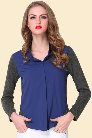Colorblock knit sleeve blouse in dark blue with a pointed collar and button front.