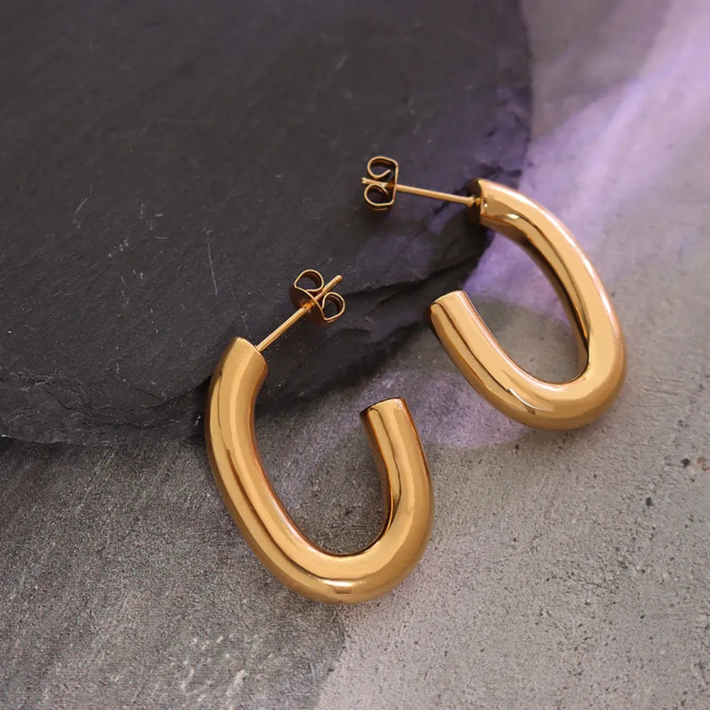 Sculpted gold vermeil hoop earrings with a polished finish.