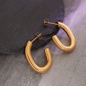 Sculpted gold vermeil hoop earrings with a polished finish.