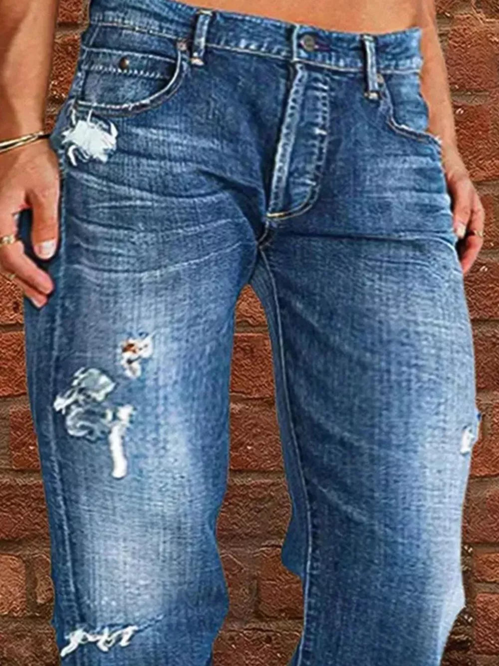 Relaxed fit blue denim maternity jeans with distressed details and raw hem