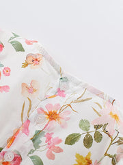 Toddler floral dress with ruffle sleeves and button detail in watercolor pink and yellow flowers.