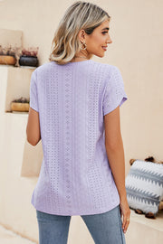 Lavender eyelet sleeve detail V-neck top with short sleeves and a casual fit.