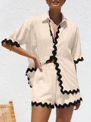 Chic trimmed sleeve pajama set in tan with black scalloped trim.