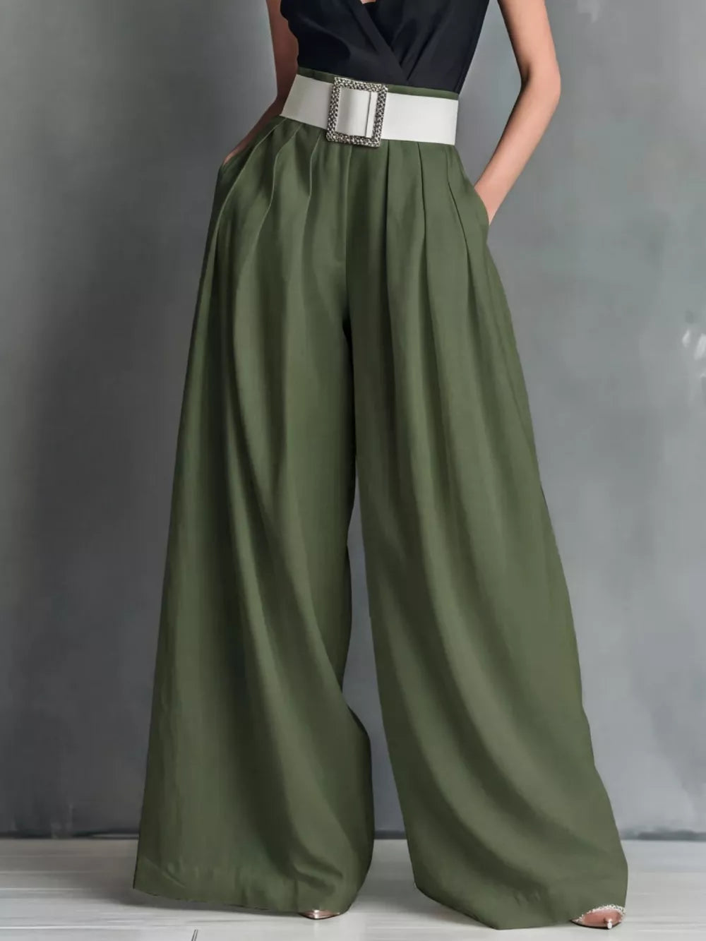 Belted high-waisted wide-leg pants in army green with a white belt and silver buckle.