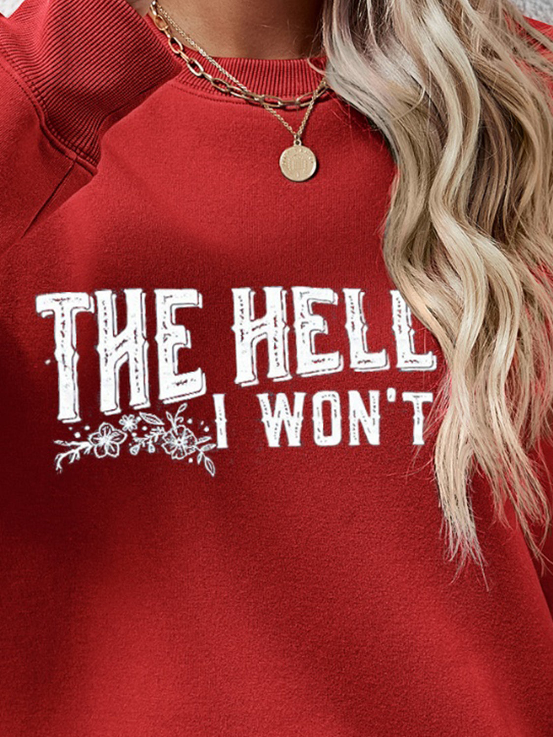 Graphic crewneck sweatshirt in Deep Red with white text and floral detail.