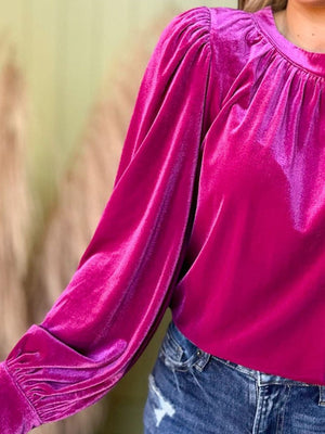 Hot pink velvet ruched long sleeve blouse with gathered neckline and puff sleeves.