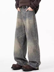 Men's belted wide-leg jeans in distressed blue denim with a relaxed fit.