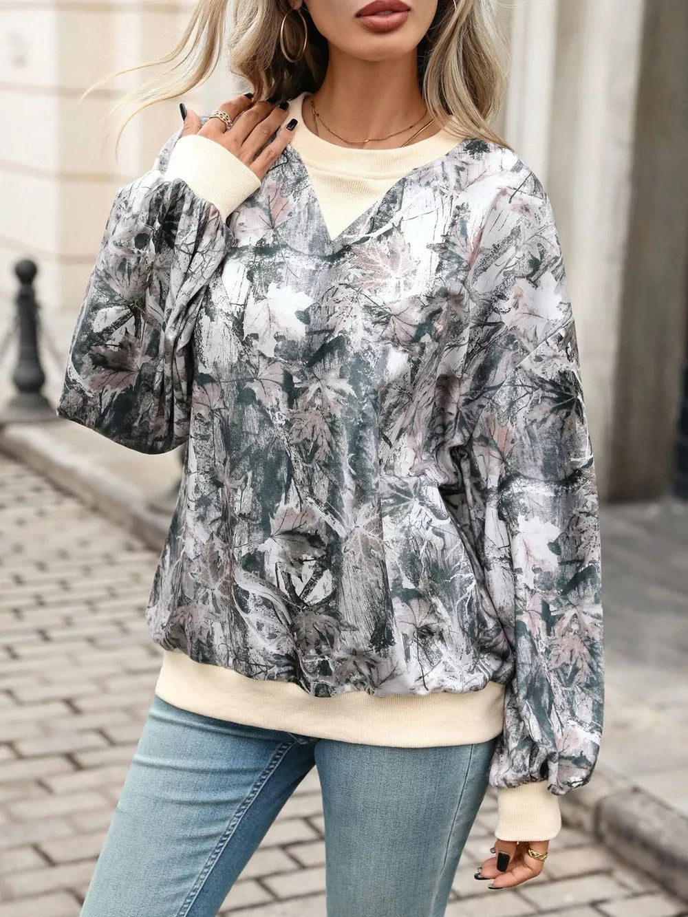 sage green sweatshirt featuring contrasting trim and leaf-print