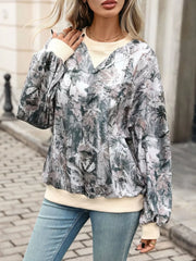 sage green sweatshirt featuring contrasting trim and leaf-print