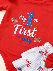 Red baby bodysuit with My 1st of July graphic and striped shorts with flag print.