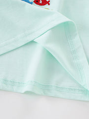 Light blue cotton crew neck t-shirt with embroidered fish detail.
