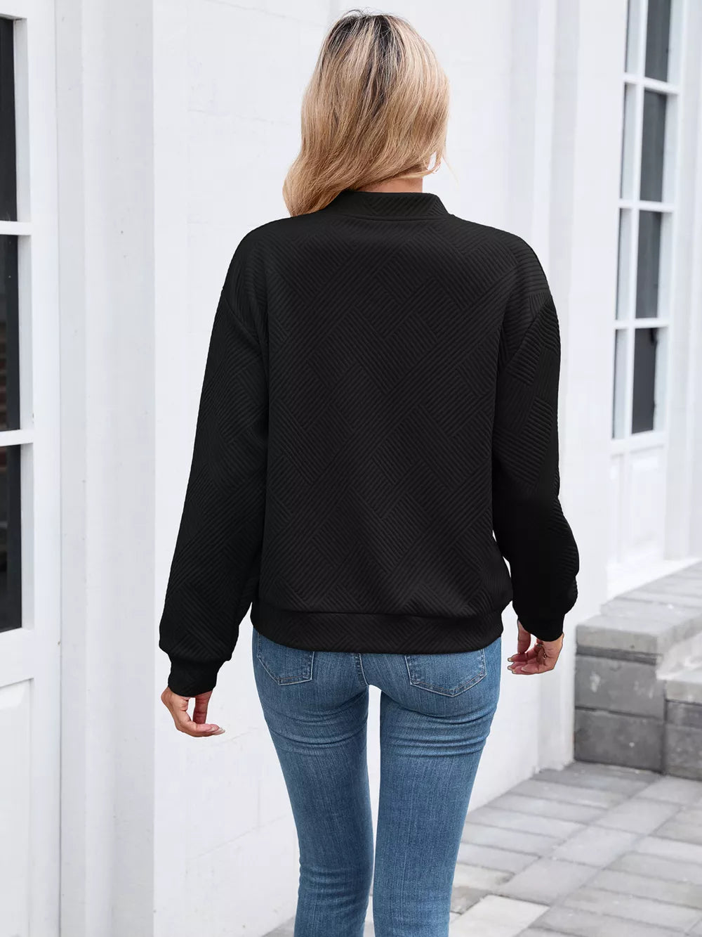Blue bomber jacket featuring zipper and geometric