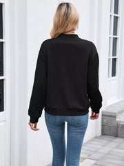 Blue bomber jacket featuring zipper and geometric