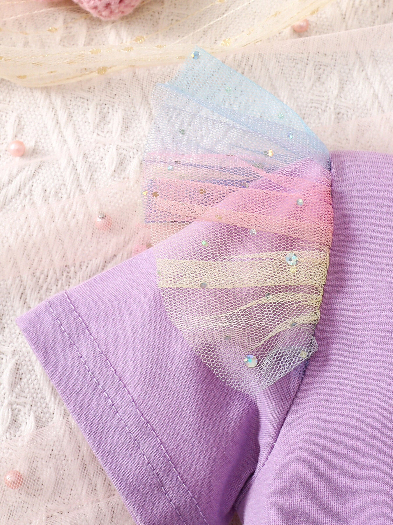 Baby dress with rainbow glitter tulle sleeves and purple cotton bodice.