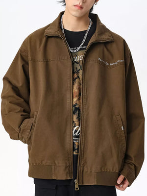 Men's brown cotton zip-up jacket with pockets and embroidered detail.