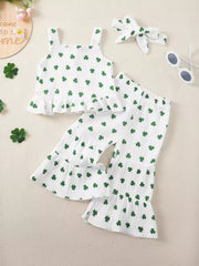 White cotton baby set with green shamrock print, ruffle trim tank top and bell bottom pants.