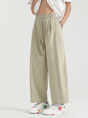 Men's khaki lightweight drawstring sweatpants with a relaxed fit.