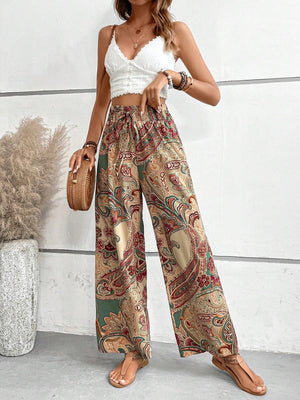 Paisley palazzo trousers with drawstring waist in multicolor, featuring a wide leg and boho print.