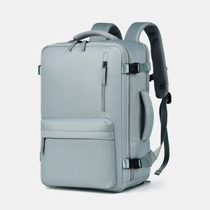 Travel backpack in beige with zippered front pocket and padded straps.
