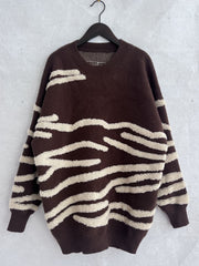 Brown acrylic crewneck sweater with textured cream stripes.