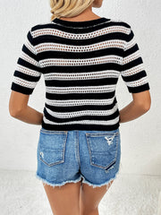 Black and white striped open-knit crew neck sweater with short sleeves.