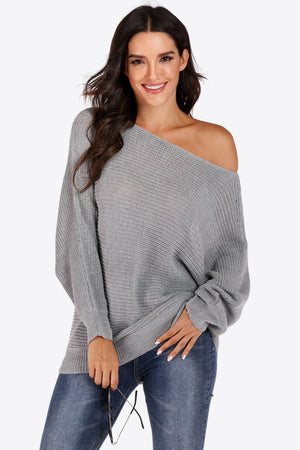 Light gray off-shoulder batwing knit sweater with a relaxed fit and textured knit.