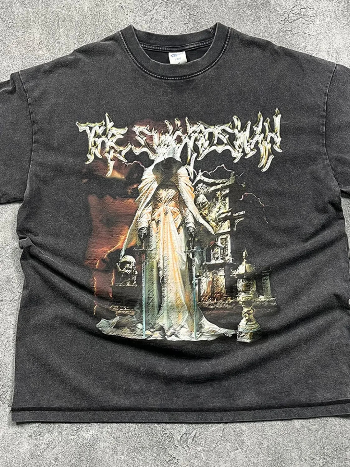 Vintage wash black graphic tee with a hooded figure and gothic imagery.