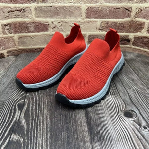 Red breathable round toe slip-on sneakers with grey soles
