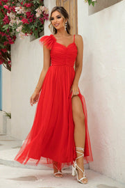 Red tulle gown with asymmetrical ruffle sleeve and high slit