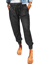 Shadow Leopard Relaxed-Fit Drawstring Trousers in Charcoal with pockets and cuffed ankles.
