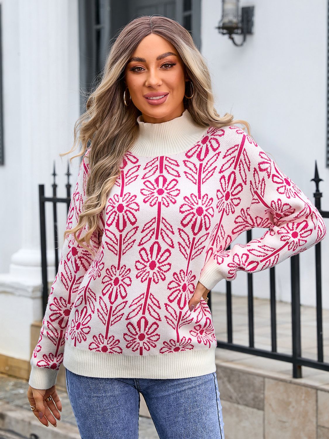 Geometric floral knit turtleneck pullover in cream with pink flowers and leaves pattern.