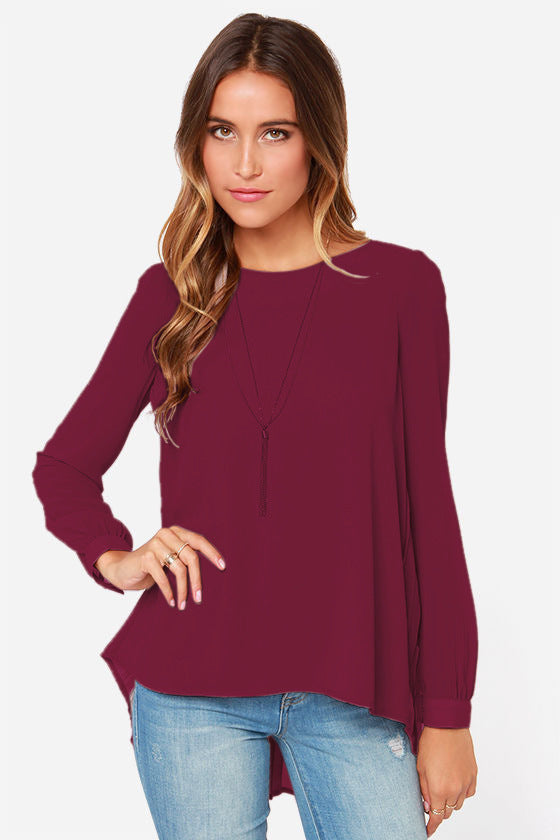 Burgundy long sleeve blouse with a fluid silhouette and pleated back detail.
