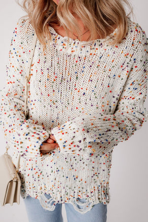 Confetti knit sweater in white with colorful flecks and distressed hem.