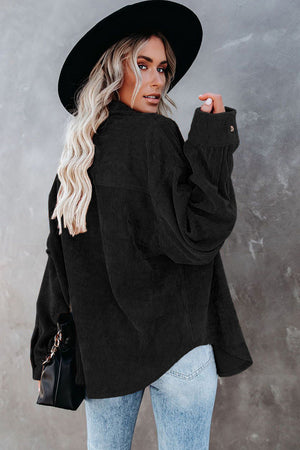 Black corduroy shirt jacket with button detail and relaxed fit.