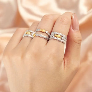 Adjustable silver rings with gold fish accents, Style A and Style B shown on hand.
